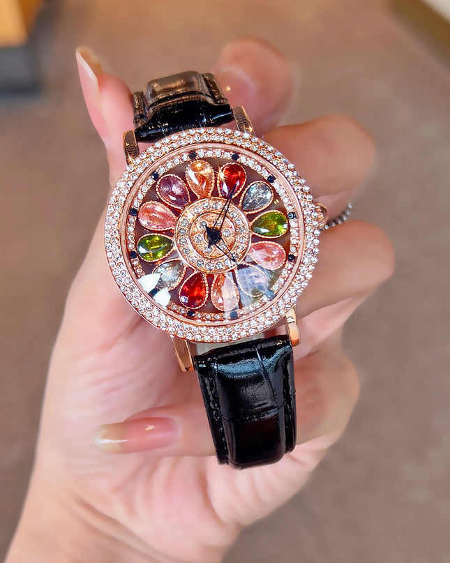Funkelnde und modische Damen-Quarzuhr mit farbenfrohen Strasssteinen, einem attraktiven drehbaren Zifferblatt und robustem Design.