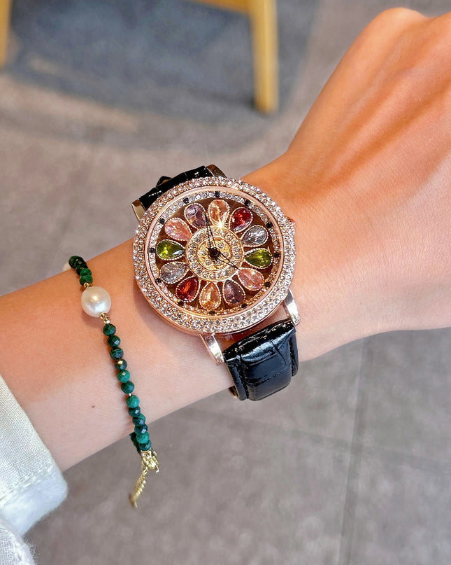 Funkelnde und modische Damen-Quarzuhr mit farbenfrohen Strasssteinen, einem attraktiven drehbaren Zifferblatt und robustem Design.
